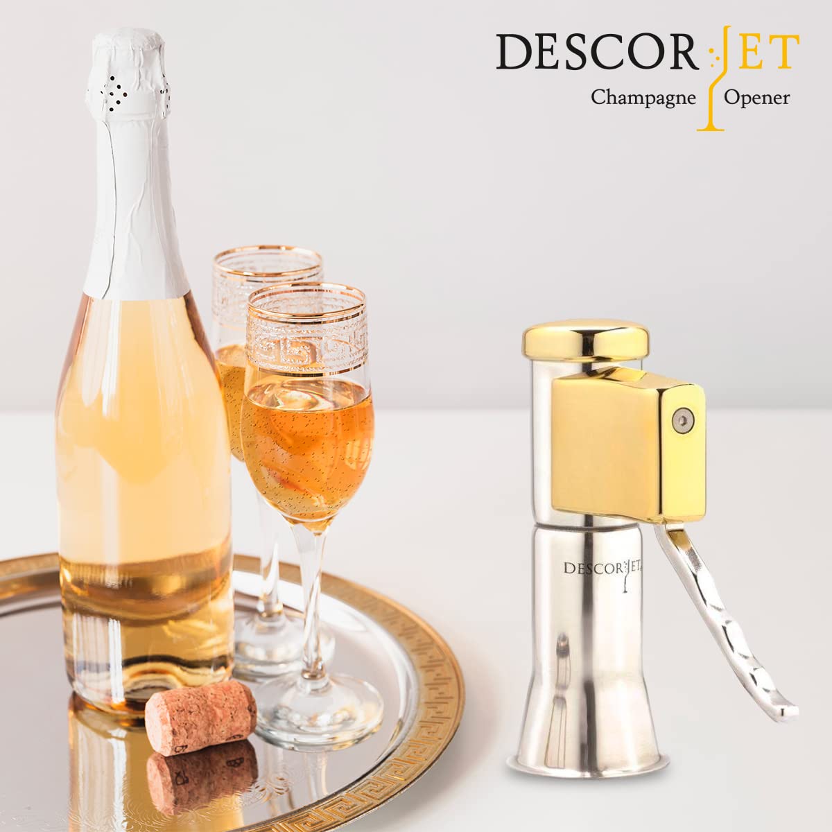 Descorjet Champagne Bottle Opener. Open your bottles with this One-hand corkscrew. Elegant, original and easy to use. Stainless steel with golden details. (Model Gold)