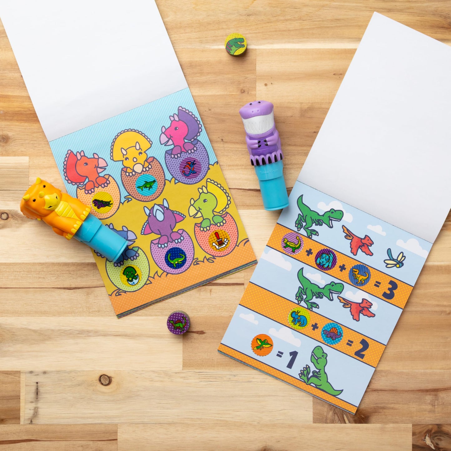 Melissa & Doug Sticker Wow!™ T-Rex and Triceratops Bundle: Two 24-Page Activity Pads, 2 Sticker Stampers, 900 Stickers, Arts and Crafts Fidget Toy Collectible Characters - FSC Certified