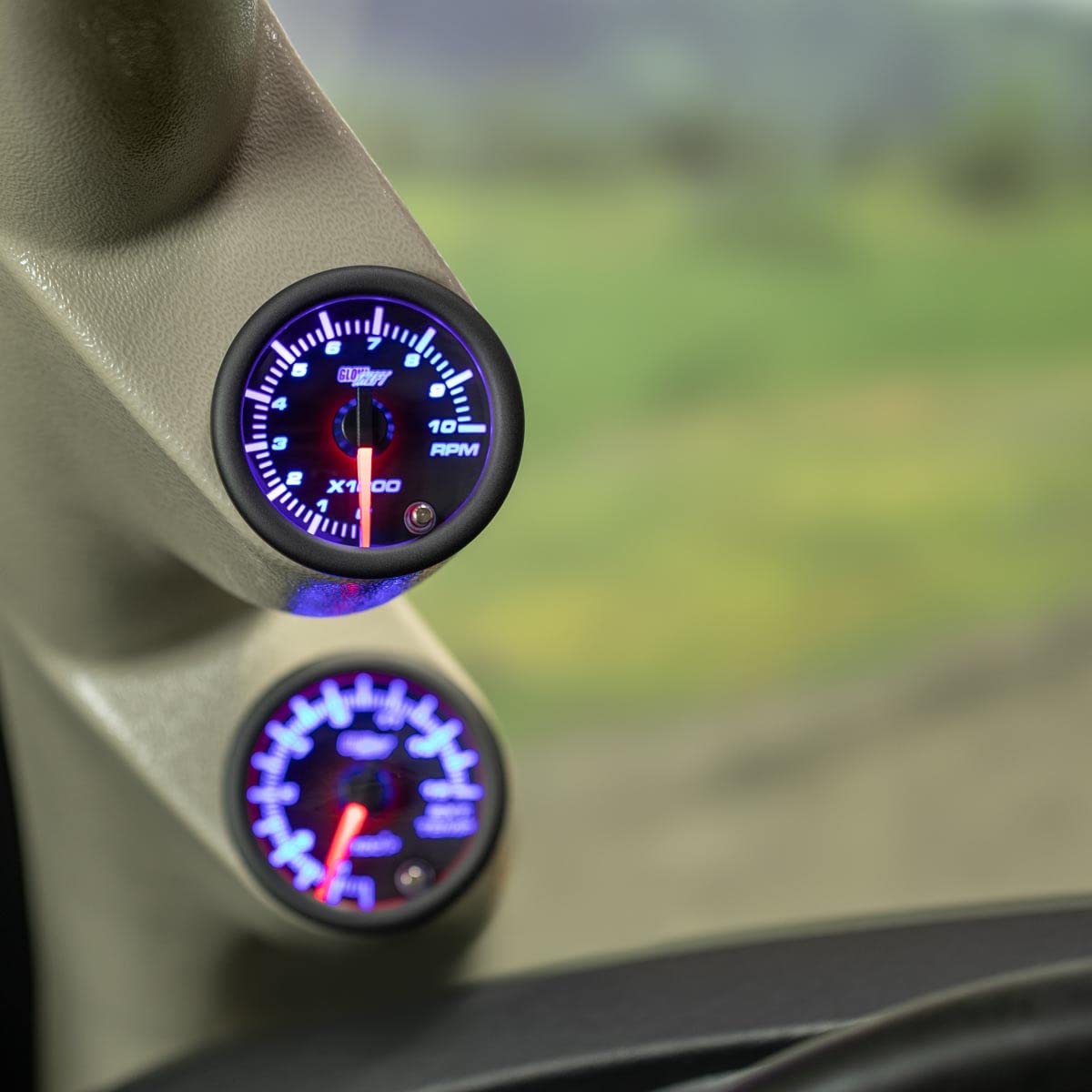 GlowShift Tinted 7 Color 10,000 RPM Tachometer Tach Gauge - for 1-10 Cylinder Gas Powered Vehicle Engines - Includes Wiring - Multi-Color Display - Black Dial - Smoked Lens - 2-1/16" 52mm