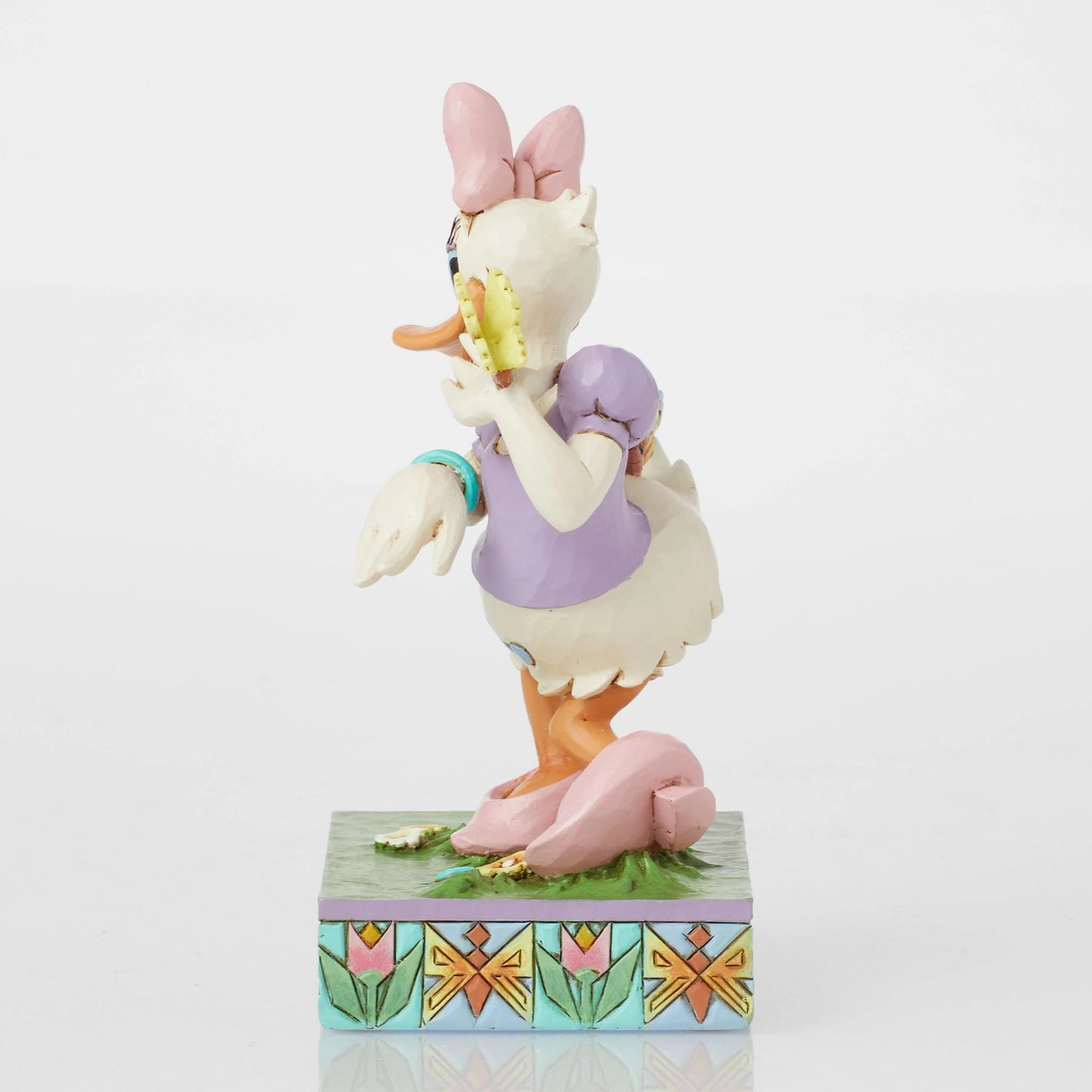 Enesco Disney Traditions Collection by Jim Shore Daisy Duck with Flowers and Butterflies Figurine- Stone Resin Hand Painted Collectible Disney Figurines Home Decor Statue, 5 Inch