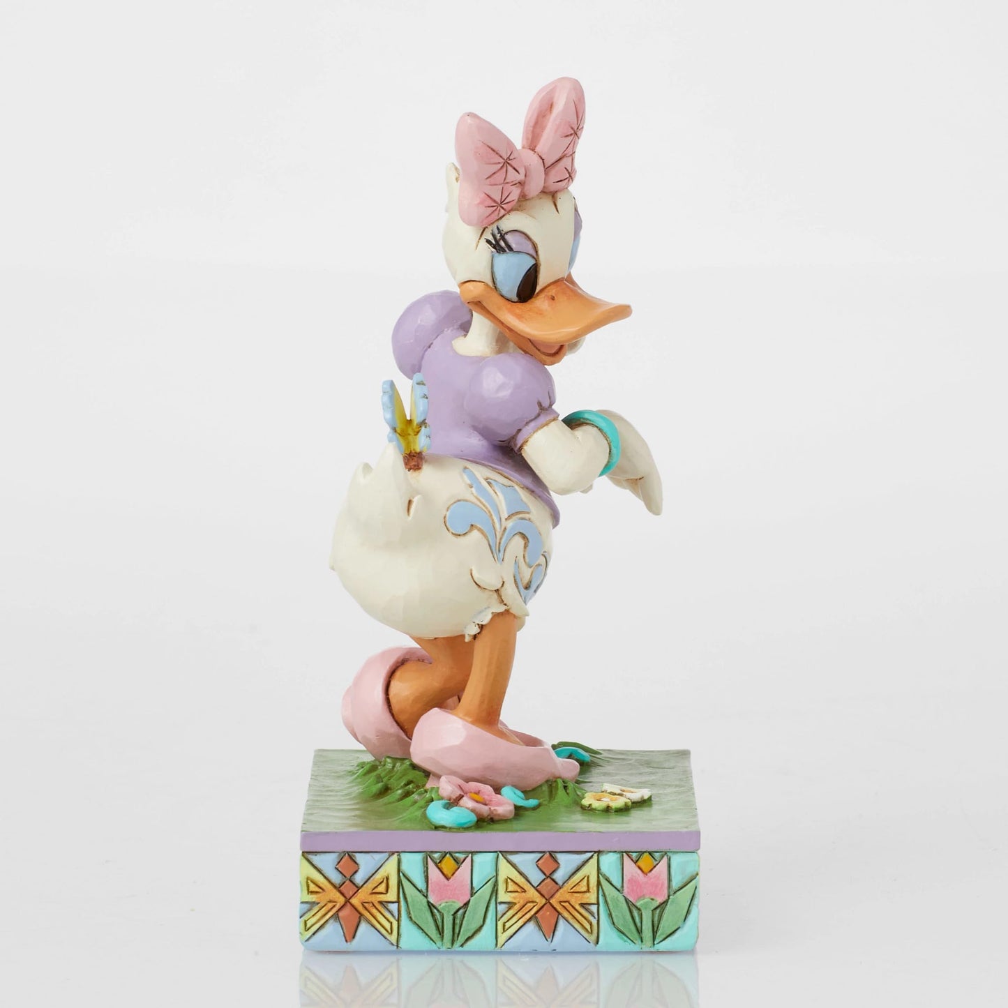Enesco Disney Traditions Collection by Jim Shore Daisy Duck with Flowers and Butterflies Figurine- Stone Resin Hand Painted Collectible Disney Figurines Home Decor Statue, 5 Inch