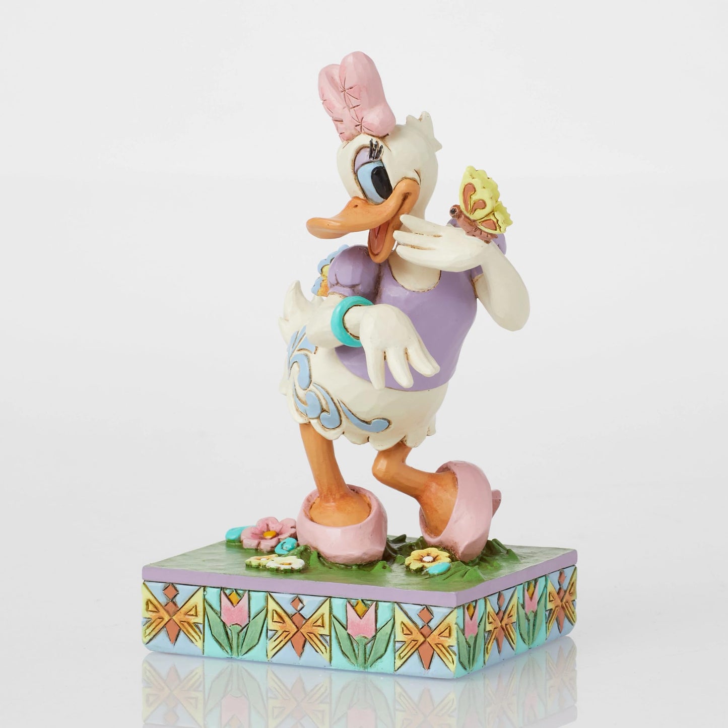 Enesco Disney Traditions Collection by Jim Shore Daisy Duck with Flowers and Butterflies Figurine- Stone Resin Hand Painted Collectible Disney Figurines Home Decor Statue, 5 Inch