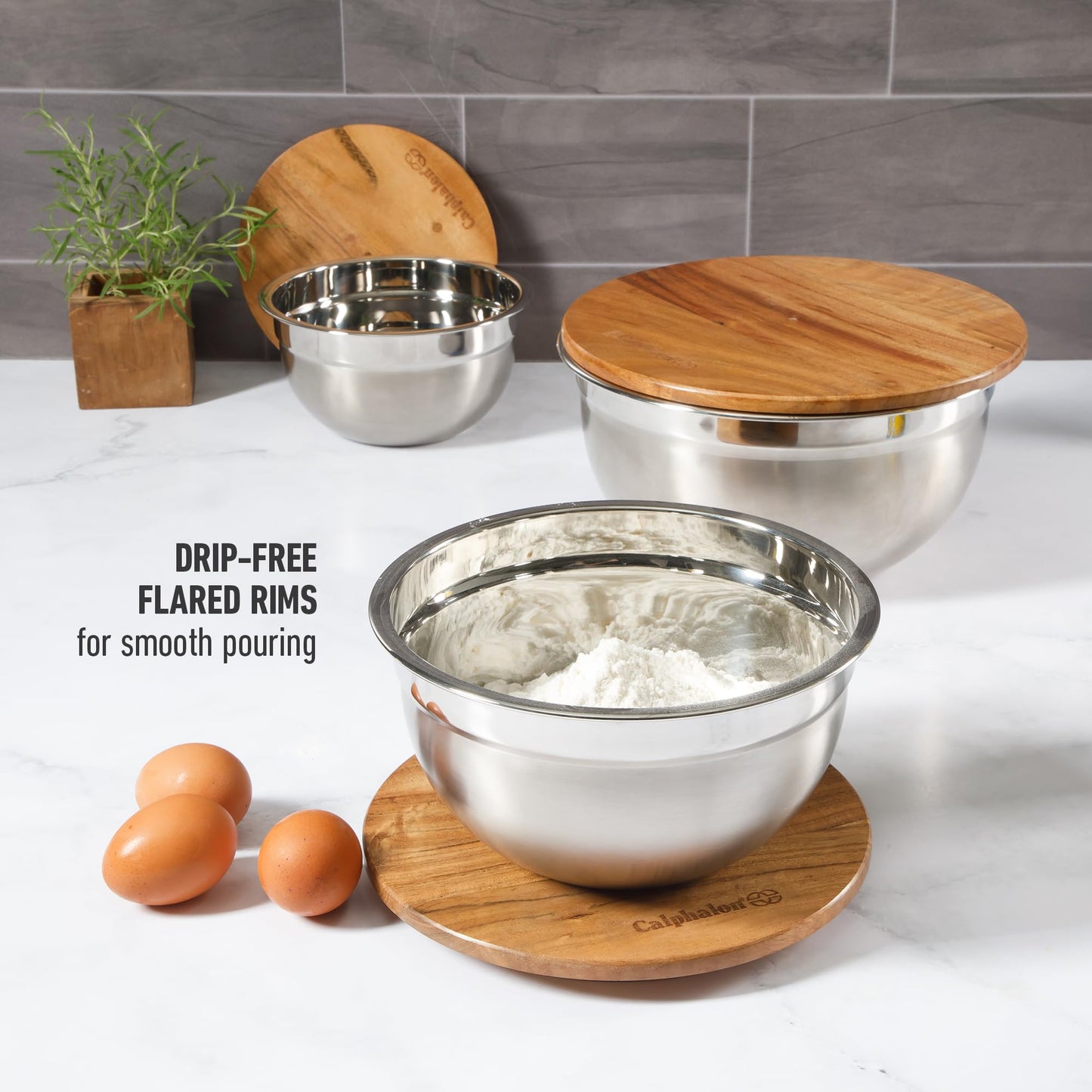 Calphalon Orbit Mixing Bowl Set, 3-Piece Stainless Steel Mixing Bowls(1.5 Qt, 3 Qt, 5 Qt) with Acacia Wood Lids & Non-Slip Base, Kitchen Prep Bowls for Mixing, Serving & Food Storage