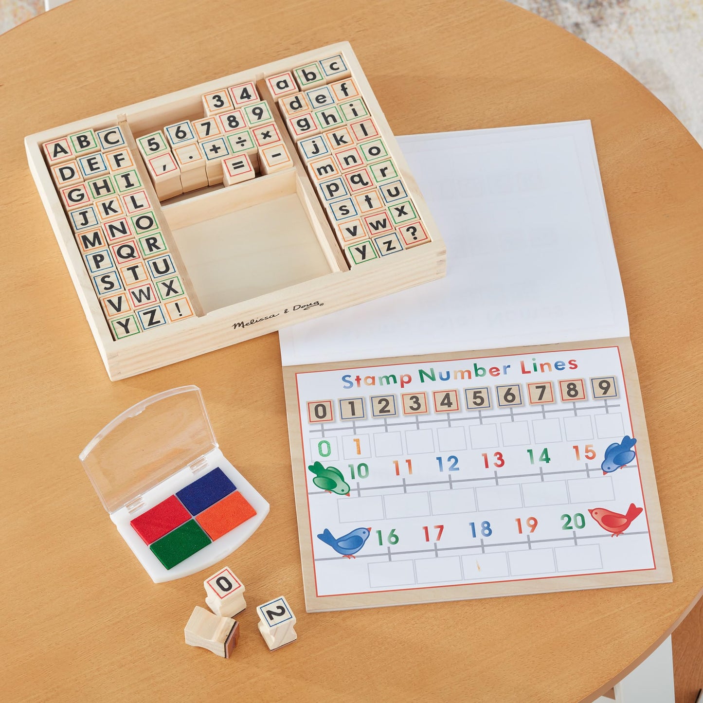 Melissa & Doug Deluxe Letters and Numbers Wooden Stamp Set ABCs 123s With Activity Book, 4-Color Stamp Pad